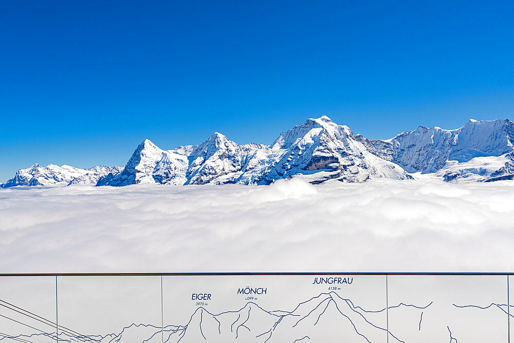 Eiger, Monch and Jungfrau peaks in a sea of clouds view from lookout terrace, Murren Birg, Bern Canton, Swiss Alps, Switzerland, Europe