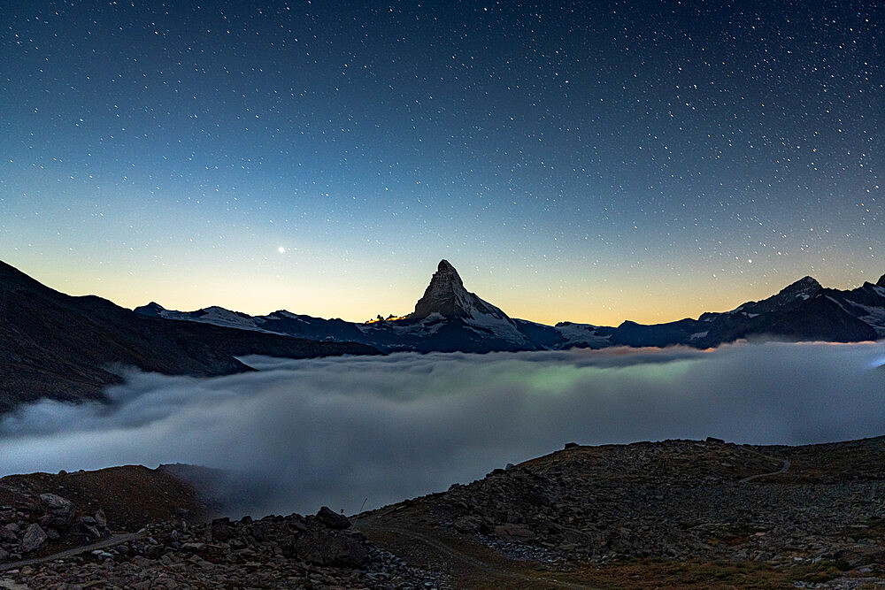 Starry night over Matterhorn in the mist, Zermatt, Valais Canton, Swiss Alps, Switzerland, Europe