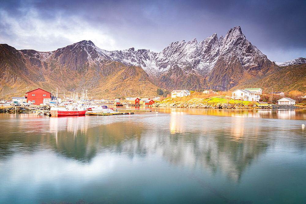 Snowcapped mountains reflected in the sea at dawn, Ballstad, Vestvagoy, Nordland county, Lofoten Islands, Norway, Scandinavia, Europe