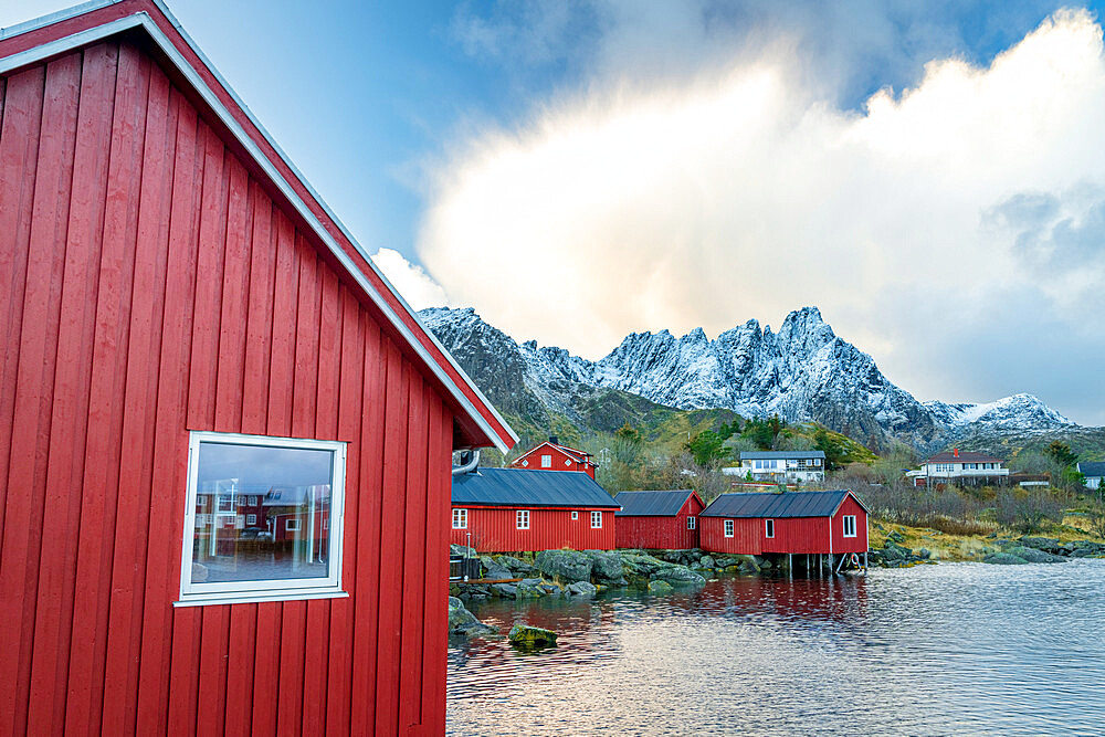 Traditional red wooden houses of fishermen at sunset, Ballstad, Vestvagoy, Nordland county, Lofoten Islands, Norway, Scandinavia, Europe