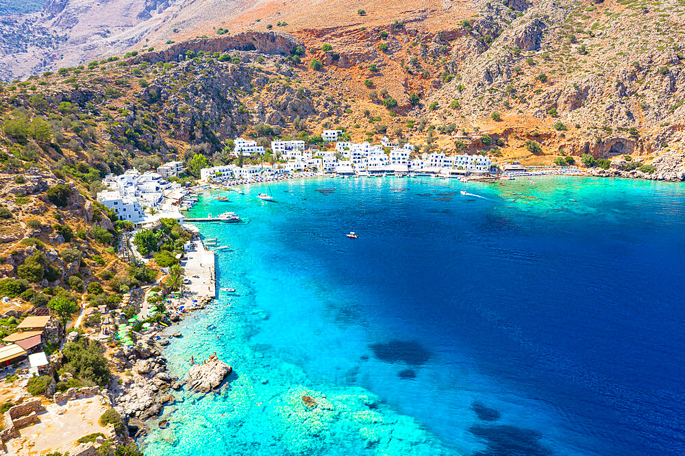 Aerial view of traditional whitewashed buildings of Loutro village and transparent sea, Crete island, Greek Islands, Greece, Europe