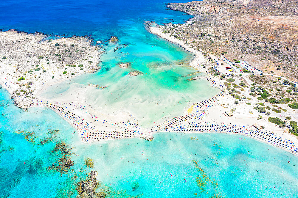 Aerial view of the equipped Elafonissi beach set in the unspoiled turquoise lagoon, Crete island, Greek Islands, Greece, Europe