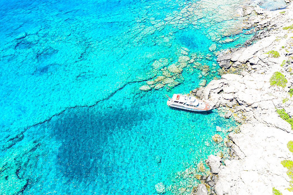 Aerial view of yacht moored in the crystal clear sea, Crete island, Greek Islands, Greece, Europe