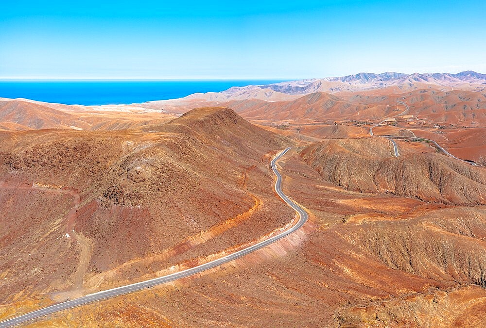 Winding road crossing the volcanic landscape towards Sicasumbre Astronomical Observatory, Fuerteventura, Canary Islands, Spain, Atlantic, Europe