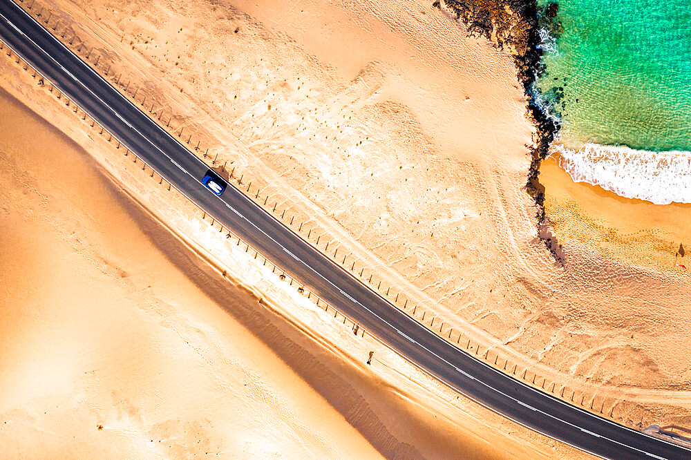 Car traveling on road in between sand dunes and ocean, aerial view, Corralejo Natural Park, Fuerteventura, Canary Islands, Spain, Atlantic, Europe