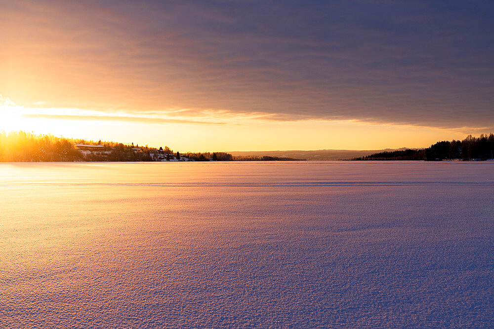 Arctic sunrise over the frozen landscape covered with snow in winter, Harads, Lapland, Sweden, Scandinavia, Europe