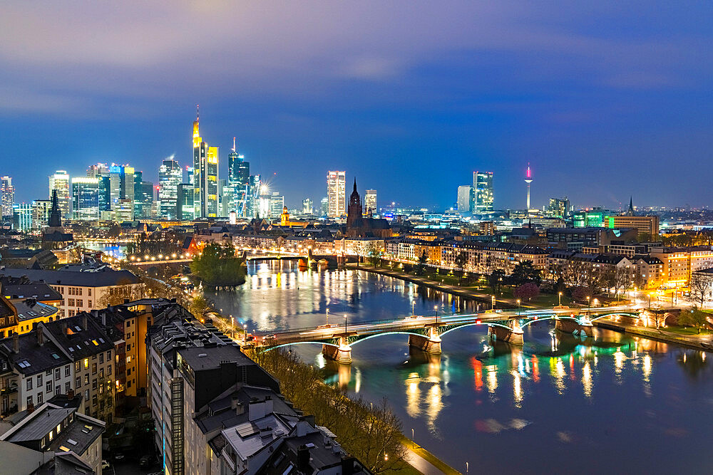 Lights of the Skyline of Frankfurt business district reflected in River Main at dusk, Frankfurt am Main, Hesse, Germany Europe