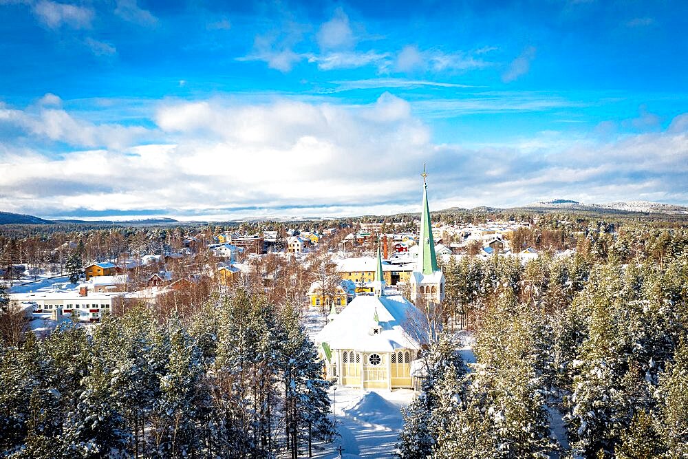 Aerial view of Jokkmokk church and forest covered with snow, Norrbotten County, Lapland, Sweden