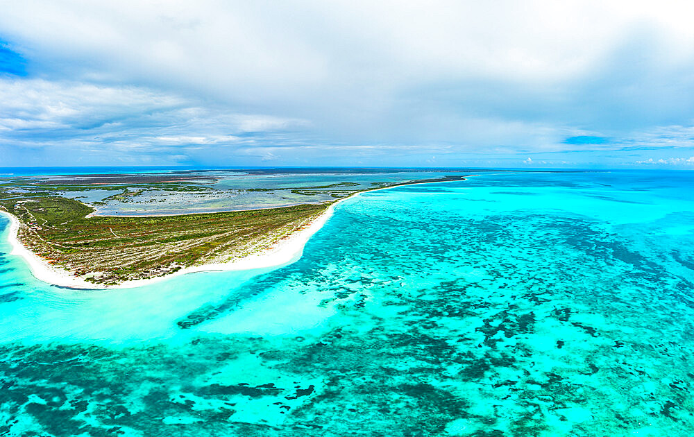 White sand of 11 Mile Beach set among a tropical lagoon and Caribbean Sea, aerial view, Barbuda, Antigua and Barbuda, West Indies, Caribbean, Central America