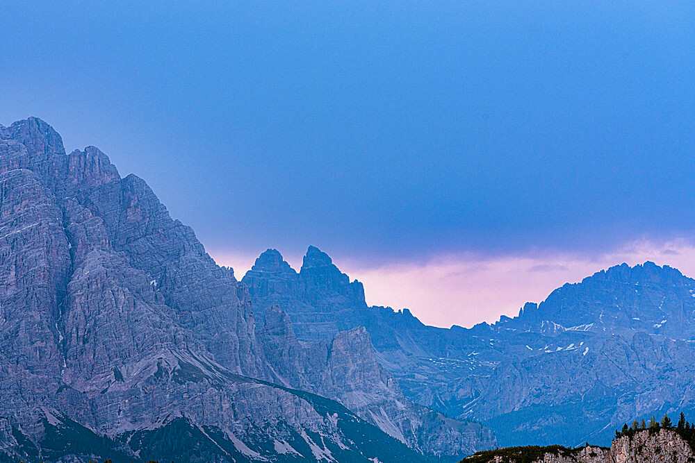 Majestic rocks of Three Peaks of Lavaredo during a pink sunrise, Dolomites, South Tyrol, Italy, Europe