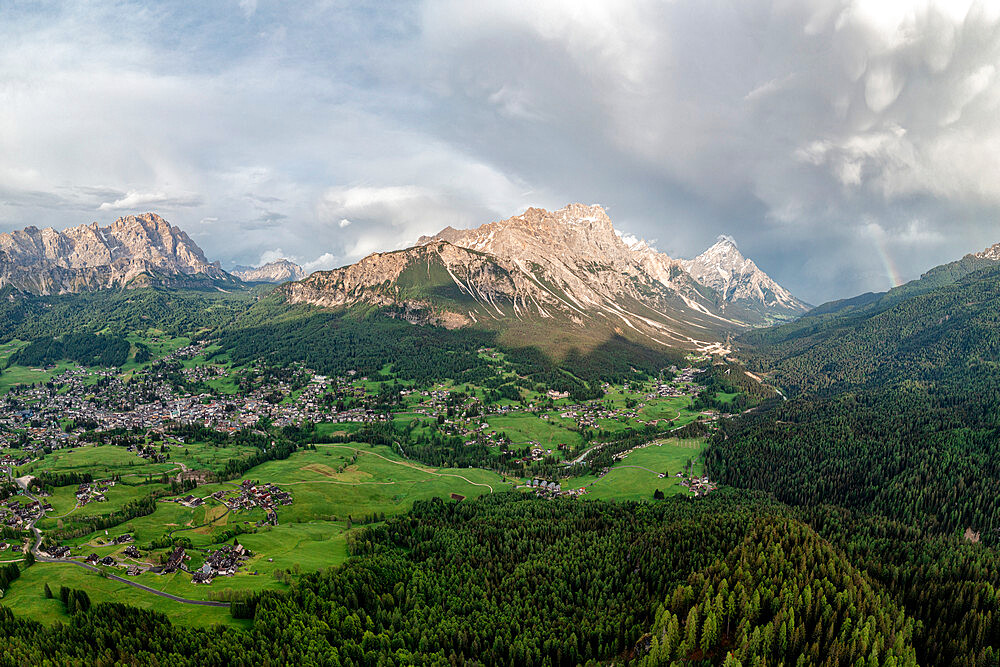 Clouds over Monte Cristallo, Sorapiss, Antelao mountains and woods in spring, Cortina D'Ampezzo, Dolomites, Veneto, Italy, Europe