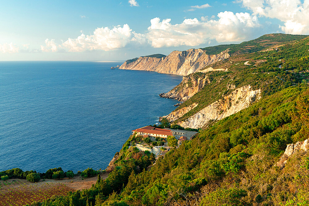 High angle view of Kipoureon monastery surrounded by trees on top of rocks overhanging the sea, Kefalonia, Ionian Islands, Greek Islands, Greece, Europe