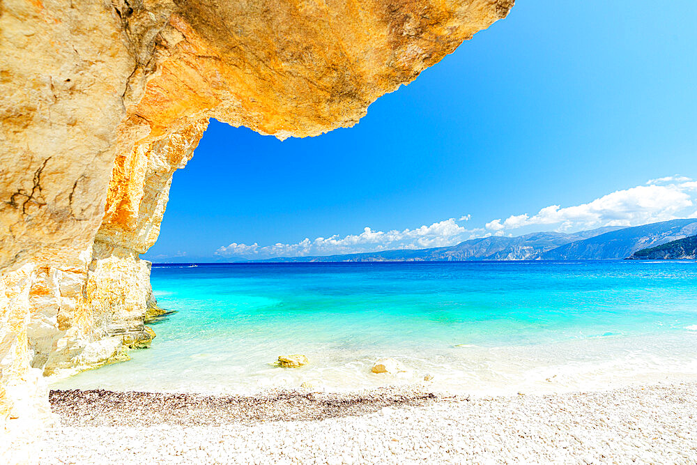 Crystal sea surrounded by limestone cliffs and white pebbles, Fteri Beach, Kefalonia, Ionian Islands, Greek Islands, Greece, Europe