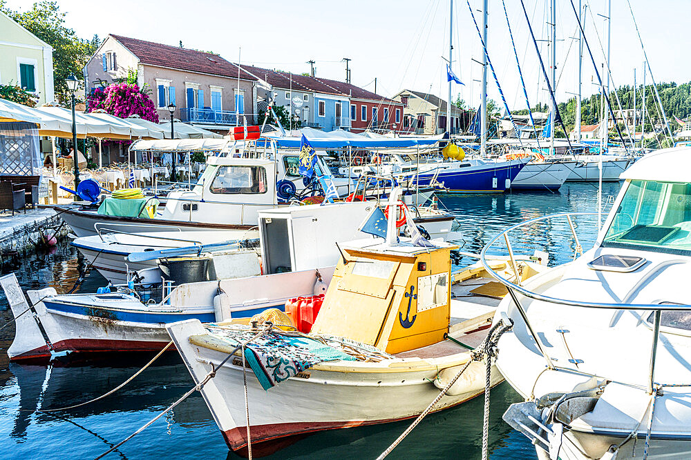 Fishing boats moored in the picturesque harbor of Fiskardo, Kefalonia, Ionian Islands, Greek Islands, Greece, Europe