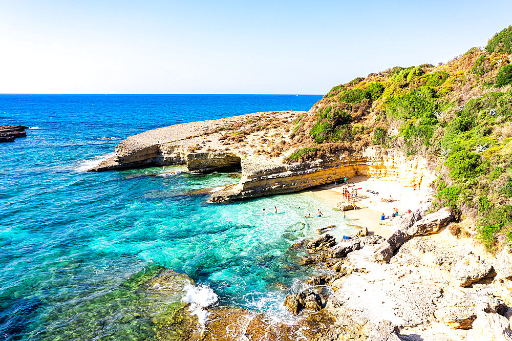 Tourists enjoying swimming in the crystal sea at the scenic Pessada beach, aerial view, Kefalonia, Ionian Islands, Greek Islands, Greece, Europe