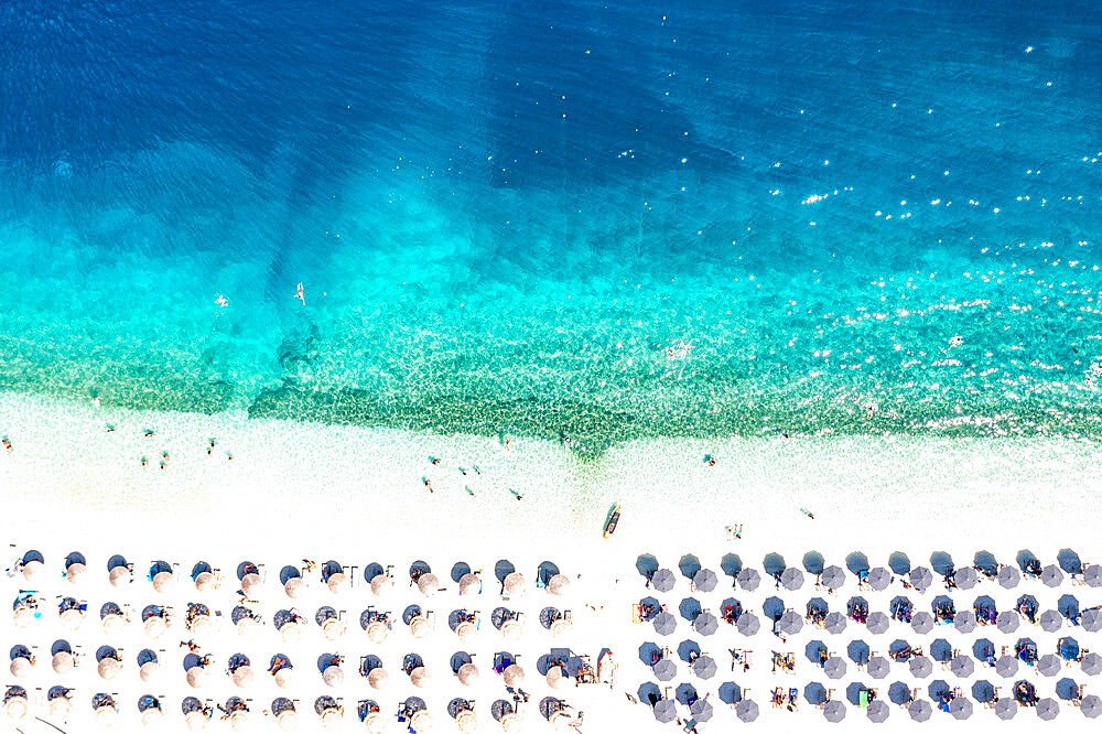 Aerial view of sunshades on idyllic beach washed by waves, Kefalonia, Ionian Islands, Greek Islands, Greece, Europe