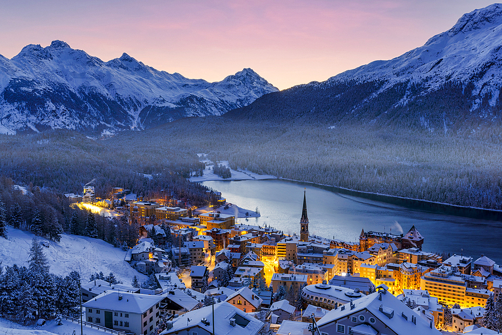 High angle view of Saint Moritz covered with snow at winter dusk, Graubunden canton, Engadin, Switzerland