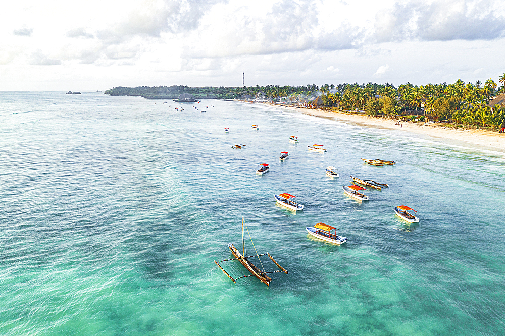 Aerial view of traditional dhow boats in the crystal sea, Pingwe, Michamvi, Zanzibar, Tanzania, East Africa, Africa