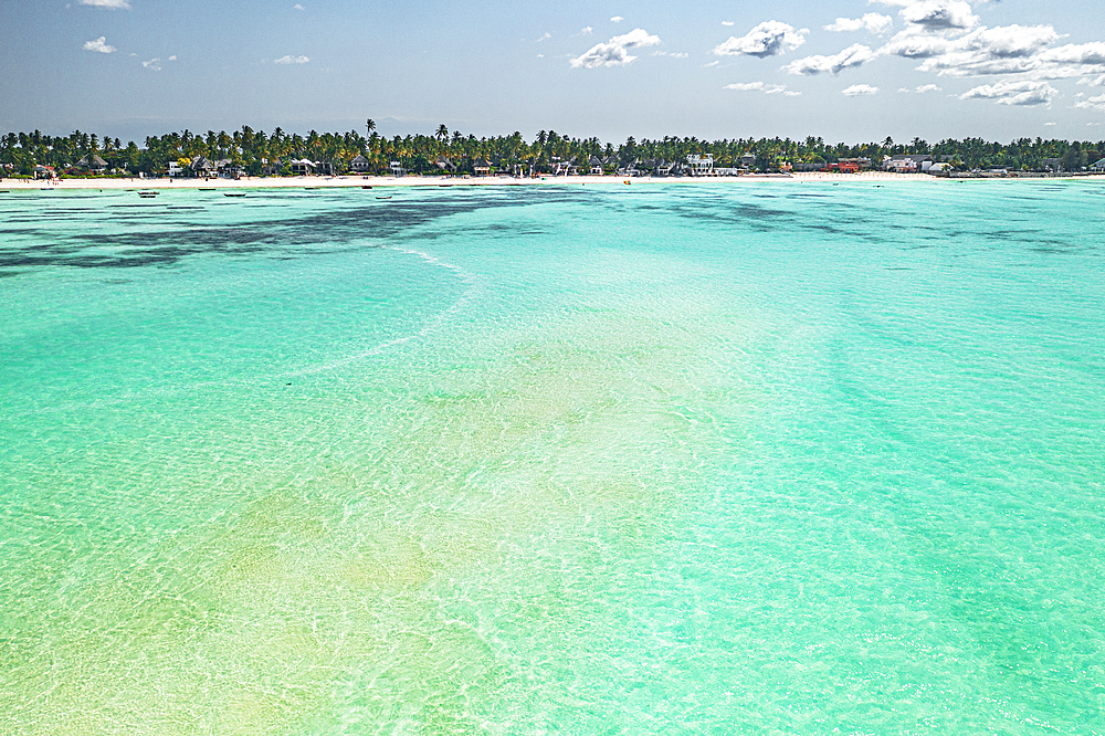 Tourist resort on palm fringed beach by a crystal lagoon, Paje, Jambiani, Zanzibar, Tanzania, East Africa, Africa