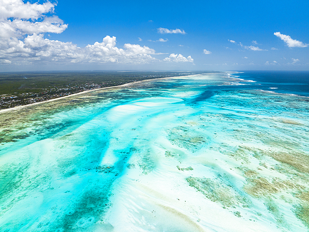 Aerial view of white coral sand of a blue lagoon at low tide, Paje, Jambiani, Zanzibar, Tanzania, East Africa, Africa