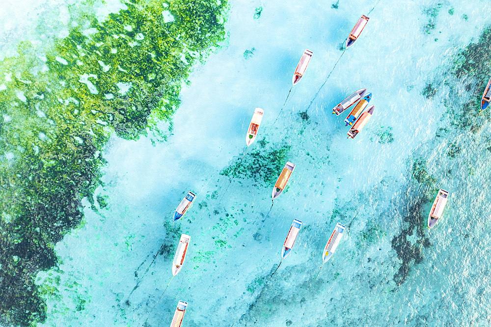 Aerial view of anchored boats in the exotic blue lagoon, Zanzibar, Tanzania, East Africa, Africa