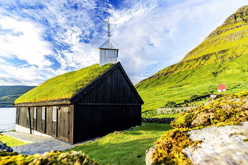 Traditional church with grass roof overlooking the fjord, Funningur, Eysturoy Island, Faroe Islands, Denmark, Europe