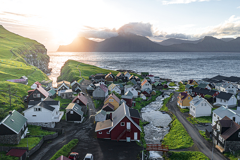 Aerial view of the coastal village of Gjogv and Kalsoy island at dawn, Eysturoy Island, Faroe Islands, Denmark, Europe