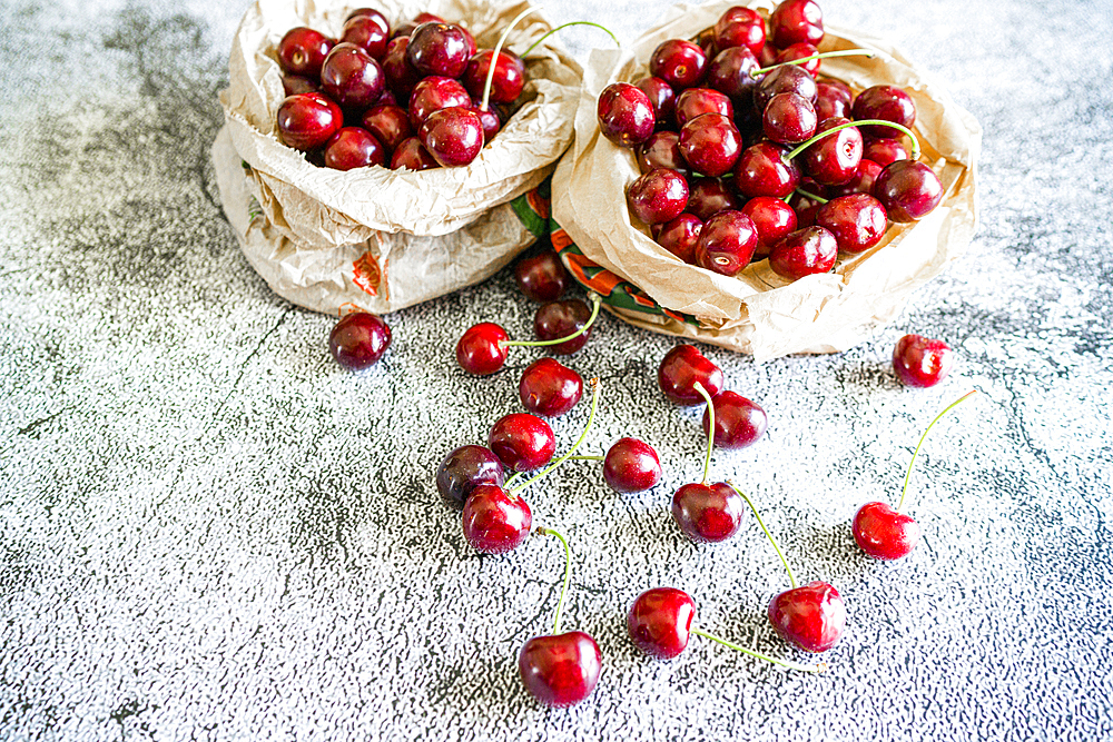 Fresh ripe cherries on a table at springtime, Italy, Europe