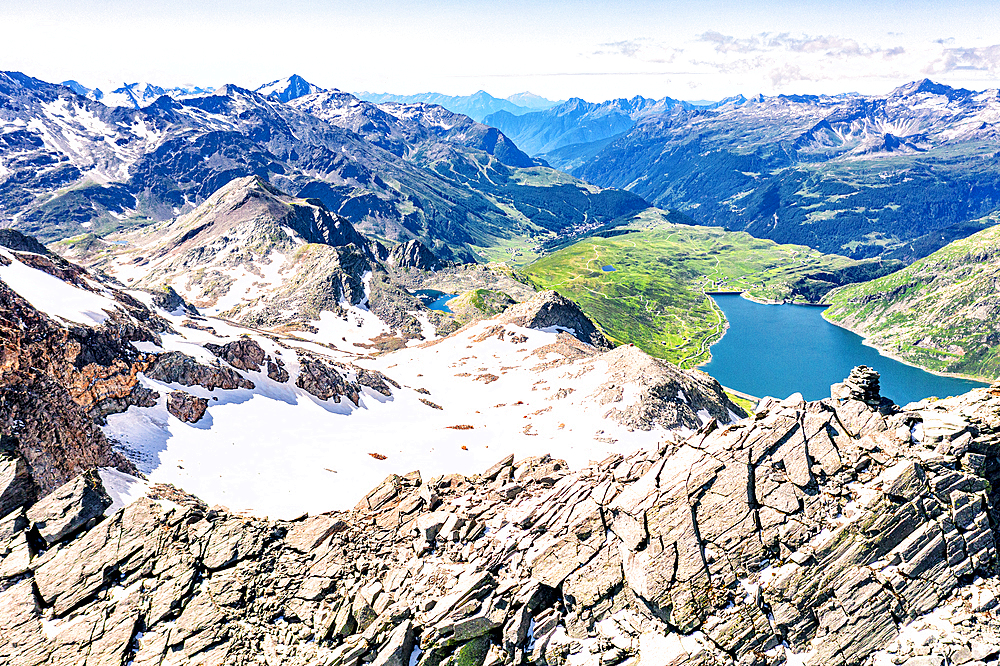 Aerial panoramic of lake Montespluga and Pizzo Suretta mountain peak, Madesimo, Valle Spluga, Valtellina, Lombardy, Italy, Europe