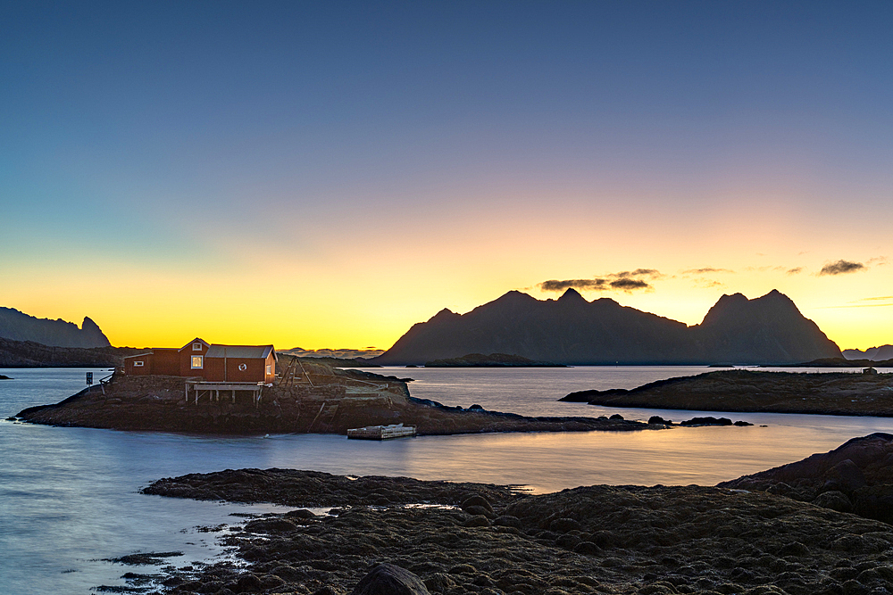 Dramatic sky at dawn over traditional rorbu, Svolvaer, Lofoten Islands, Nordland, Norway, Scandinavia, Europe