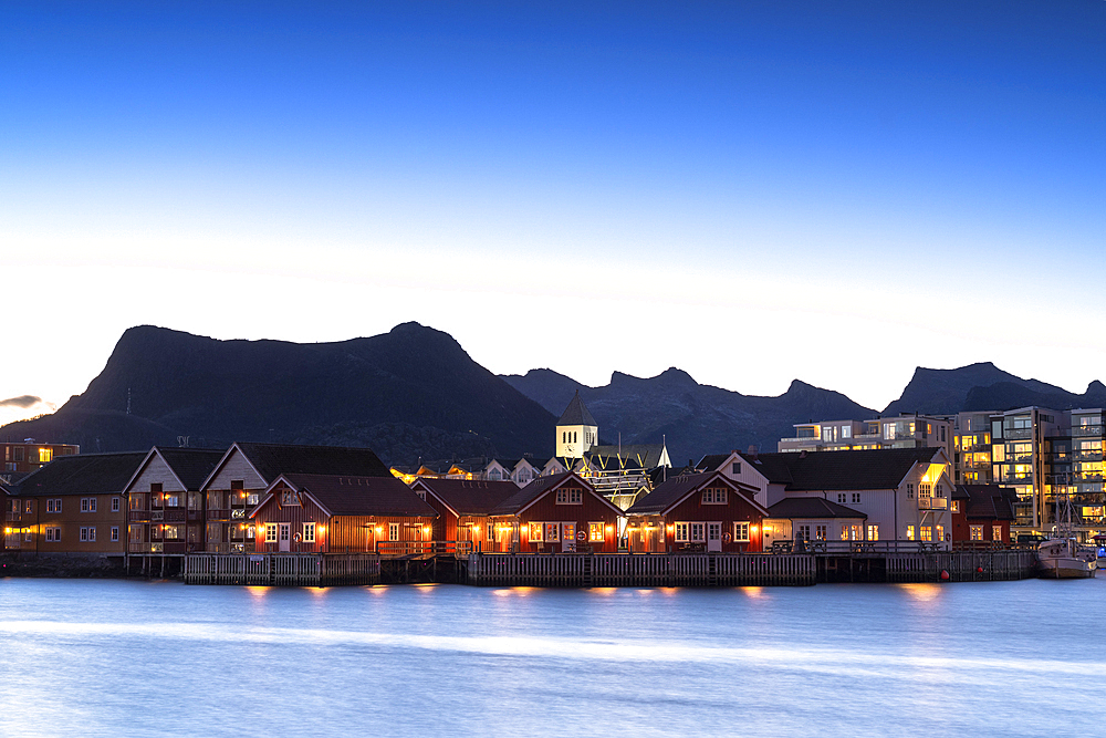 Illuminated houses at dusk, Svolvaer, Lofoten Islands, Nordland, Norway, Scandinavia, Europe