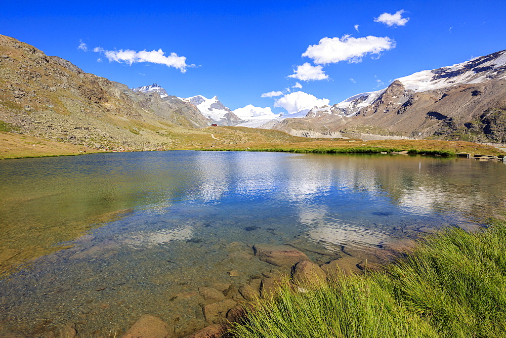 Snowy peaks reflected in Lake Stellisee, Zermatt, Canton of Valais, Swiss Alps, Switzerland, Europe