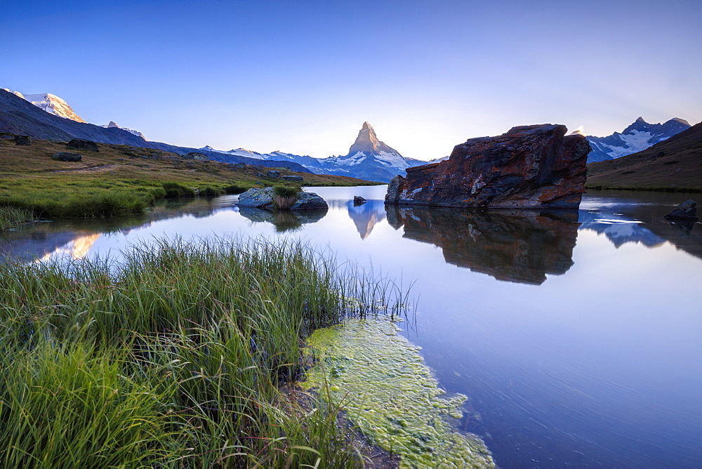 The Matterhorn reflected in Lake Stellisee at dawn, Zermatt, Canton of Valais, Pennine Alps, Swiss Alps, Switzerland, Europe