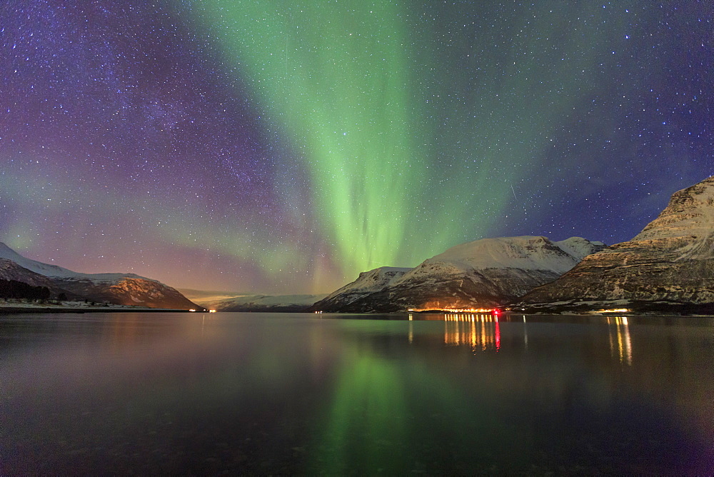 The Northern Lights illuminates the icy sea, Oteren, Storfjorden, Lyngen Alps, Troms, Lapland, Norway, Scandinavia, Europe