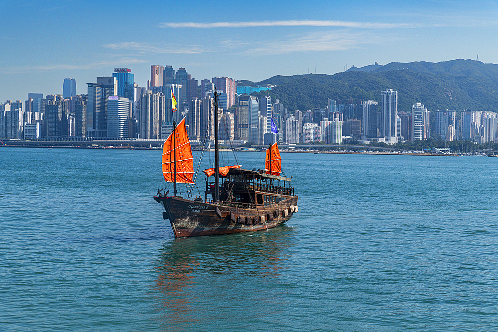 Traditional sailing boat in front of high rise buildings in Central Hongkong, China, Asia