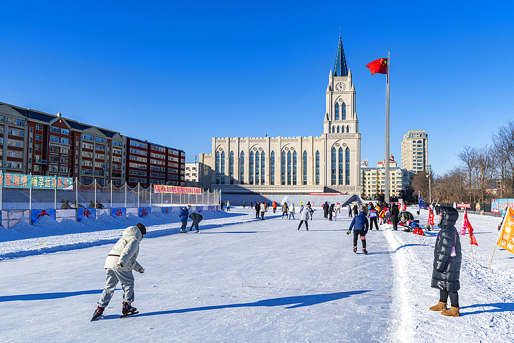 Skating rink in front of the old Cathedral, Heihe, Heilongjiang, China, Asia