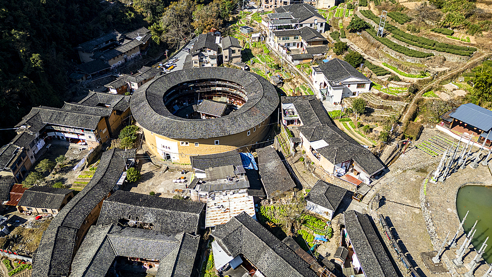 Aerial of Taxia village and Fujian Tulou, rural dwelling of the Hakka, Fujian, China, Asia