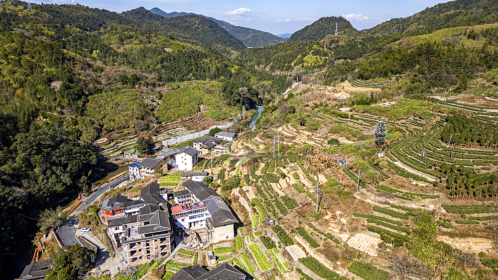 Aerial of Taxia village and Fujian Tulou, rural dwelling of the Hakka, Fujian, China, Asia