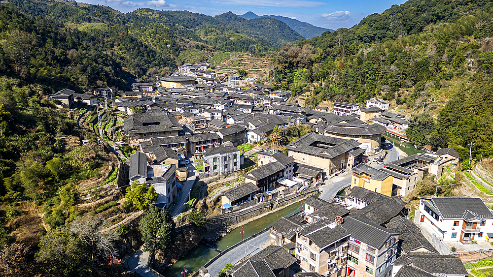 Aerial of Taxia village and Fujian Tulou, rural dwelling of the Hakka, Fujian, China, Asia