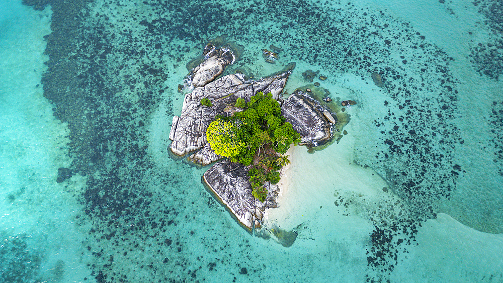 Aerial of a little islet off the coast of Belitung island off the coast of Sumatra, Indonesia, Southeast Asia, Asia