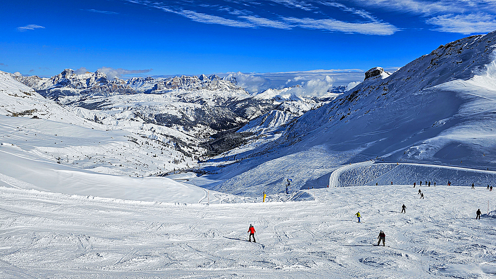 Skiers in snowy landscape, Dolomites, Italy, Europe