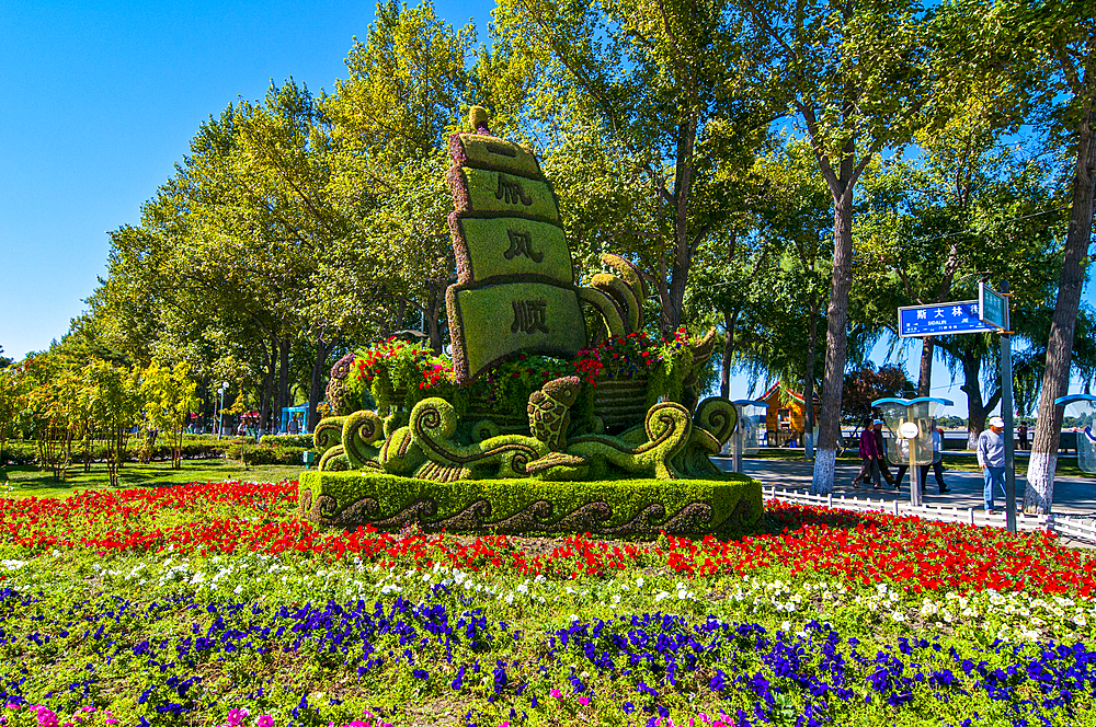 Flood monument in form of flowers in floral display, Harbin, Heilongjiang, China, Asia