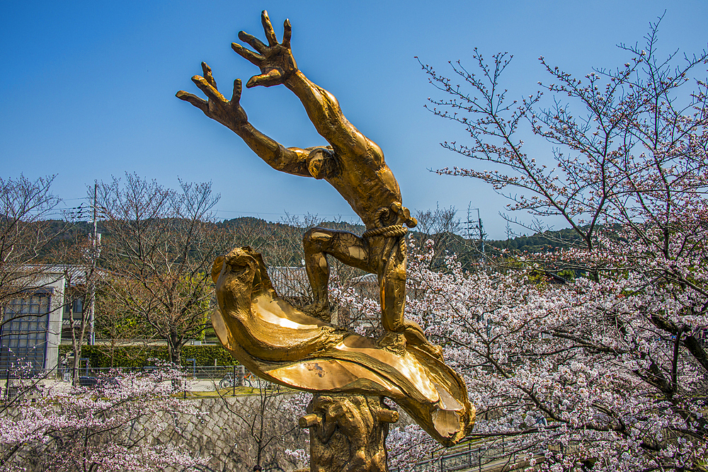 Sculpture and cherry blossom, Kyoto, Honshu, Japan, Asia