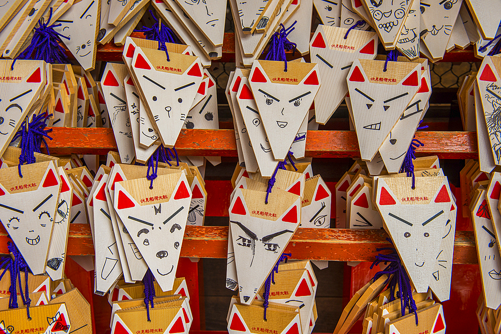 Wooden souvenir plaques at the Endless Red Gates of Kyoto's Fushimi Inari, Kyoto, Honshu, Japan, Asia