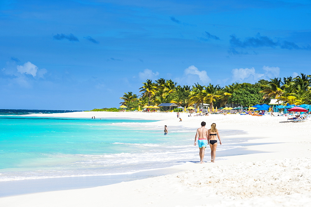 Couple walking on world class Shoal Bay East beach, Anguilla, British Oversea territory, West Indies, Caribbean, Central America