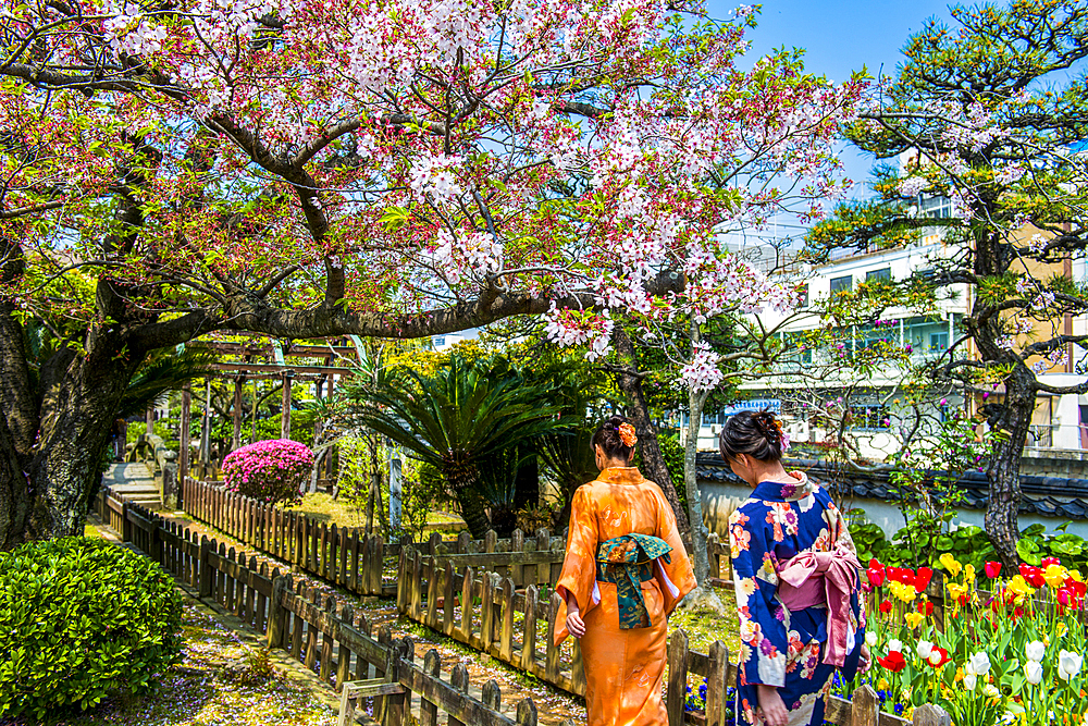 Traditionally dressed women in Dejima, a man made island in the port of Nagasaki, Kyushu, Japan, Asia