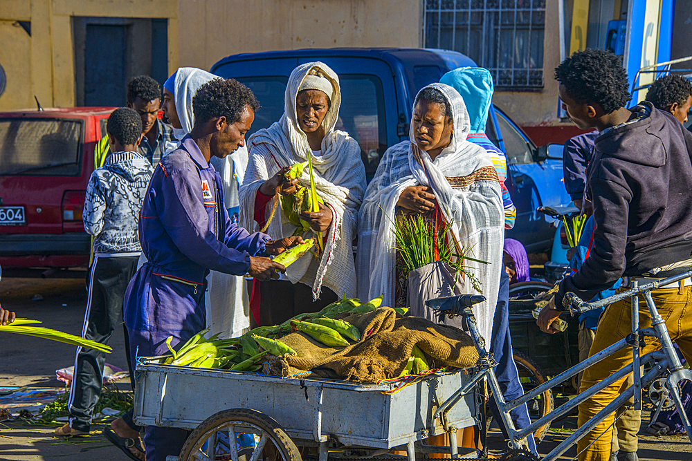 Orthodox dressed woman buying vegetables, Asmara, Eritrea, Africa