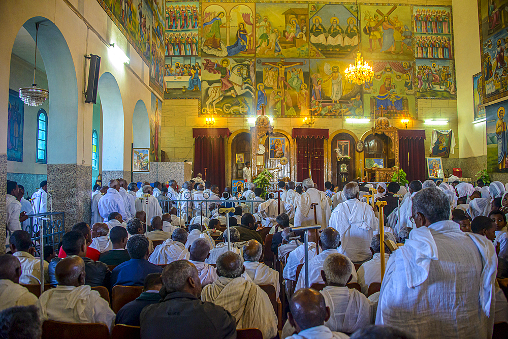 Orthodox men praying in the Coptic Cathedral of St. Mariam, Asmara, Eritrea, Africa