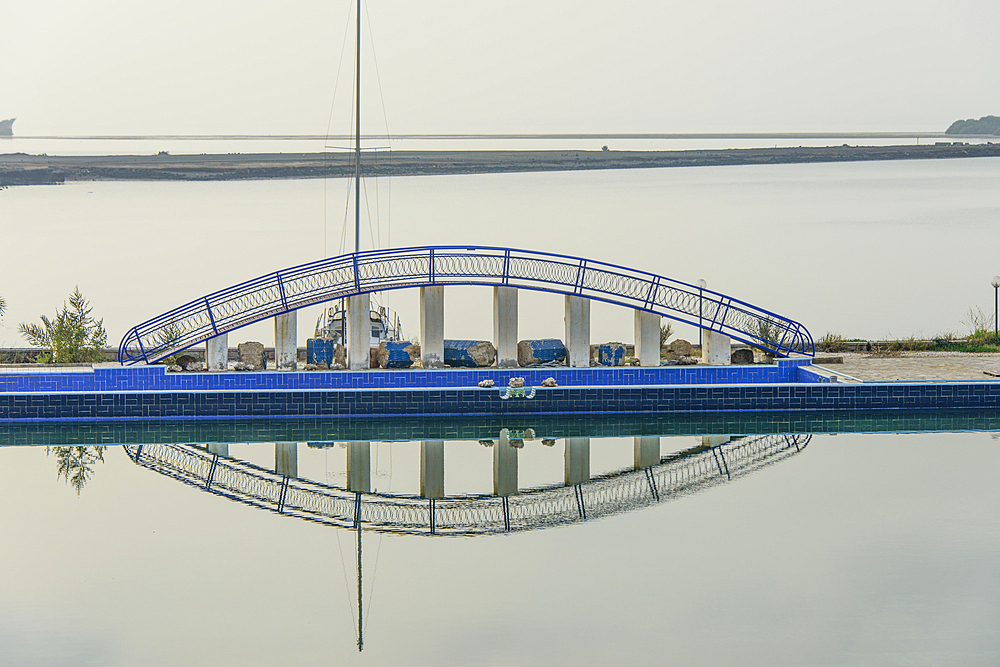 Reflections of a little bridge in a luxury hotel in the old port town of Massawa, Eritrea, Africa