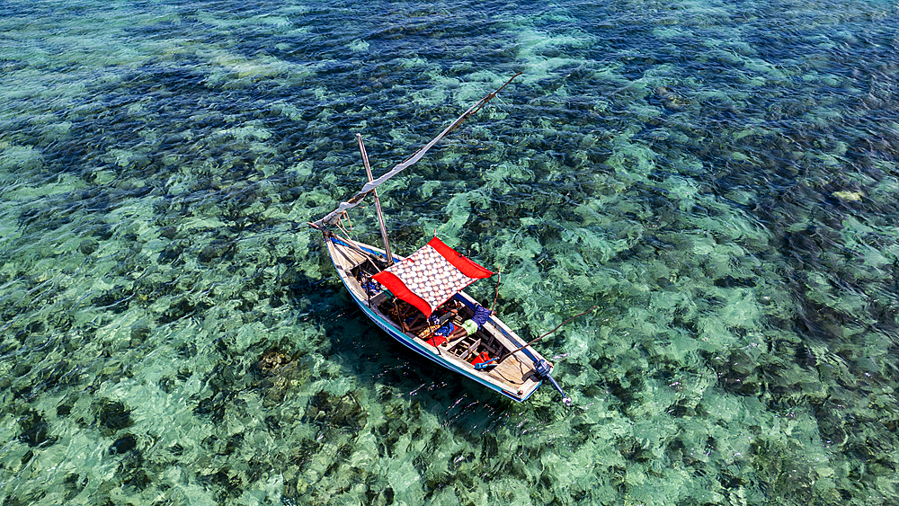 Aerial of a traditional Dhow on a white sand beach, Goa island near the Island of Mozambique, Mozambique, Africa